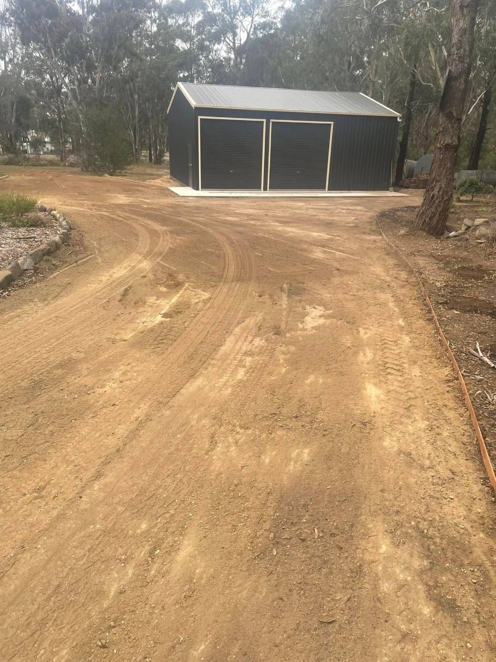 Earthworks and a graded track leading to a new steel shed